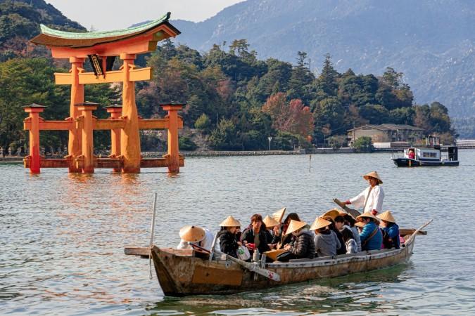 Visit the "floating" torii gate at Itsukushima Shrine